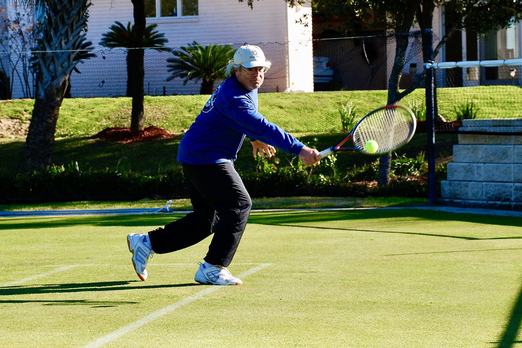 Backhand in a blue jacket
